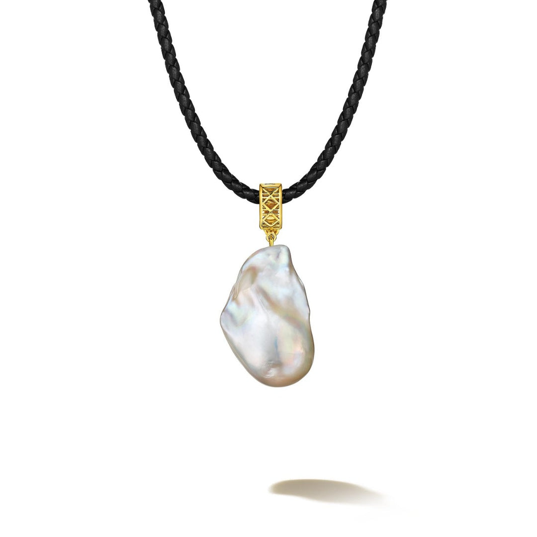 MoAnA LUU Abyss baroque pearl pendant on black leather cord with 18K yellow gold cane woven bail, inspired by Caribbean fish traps.