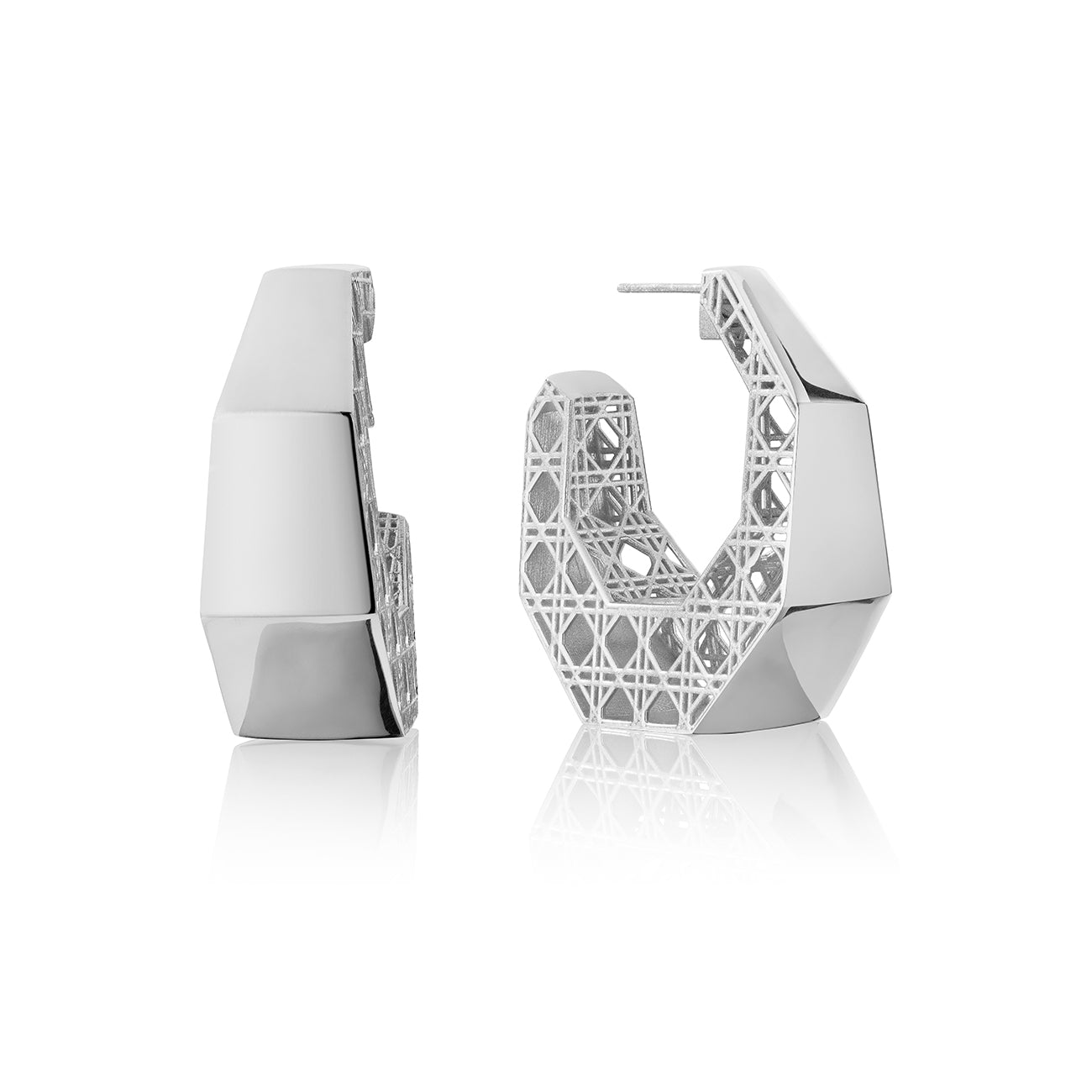 MoAnA LUU Doudou hoop earrings in silver, featuring a cane-woven work inspired by traditional Caribbean fish traps, reflecting the house’s vision of Creole-inspired jewelry crafted in New York.