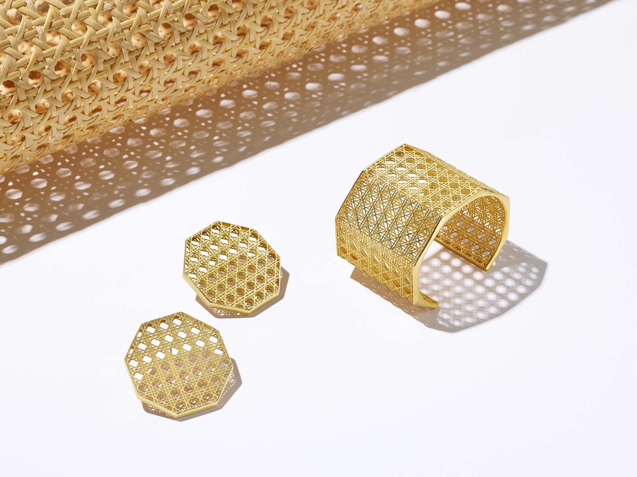 MoAnA LUU Doudou statement earrings and Doudou Maxi cuff in 18K yellow gold, featuring a cane-woven work inspired by traditional Caribbean fish traps, reflecting the house’s vision of Creole-inspired fine jewelry crafted in New York.