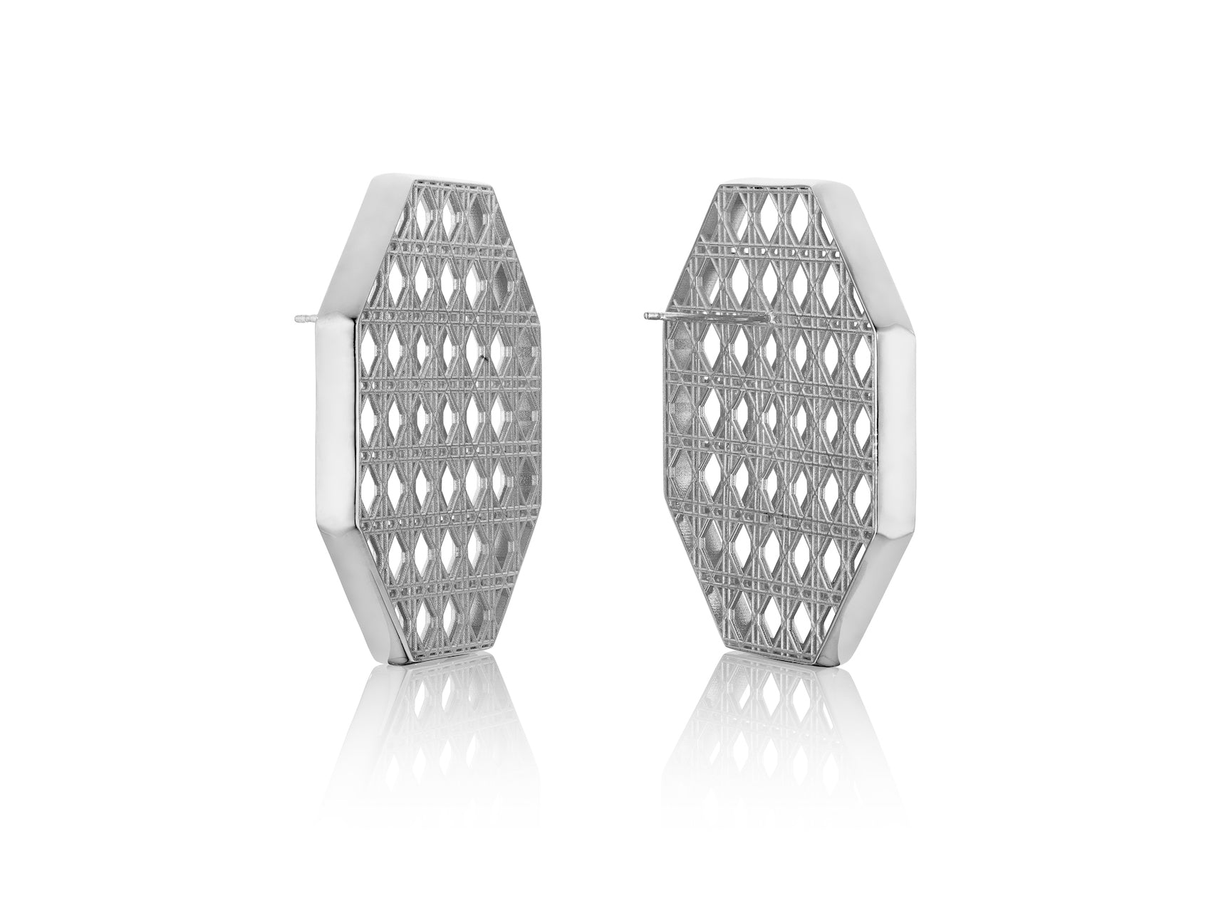 MoAnA LUU Doudou statement earrings in silver, featuring a cane-woven work inspired by traditional Caribbean fish traps, reflecting the house’s vision of Creole-inspired jewelry crafted in New York.