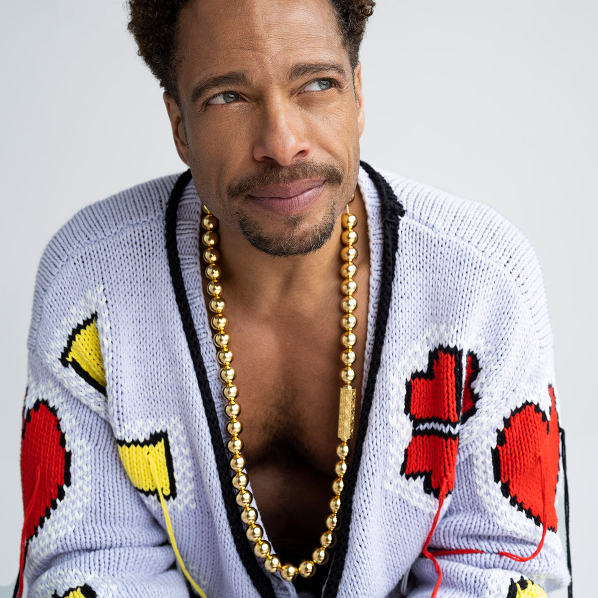 Gary Dourdan wearing MoaAnA LUU long bead necklace in vermeil. Inspired by Creole jewelry.