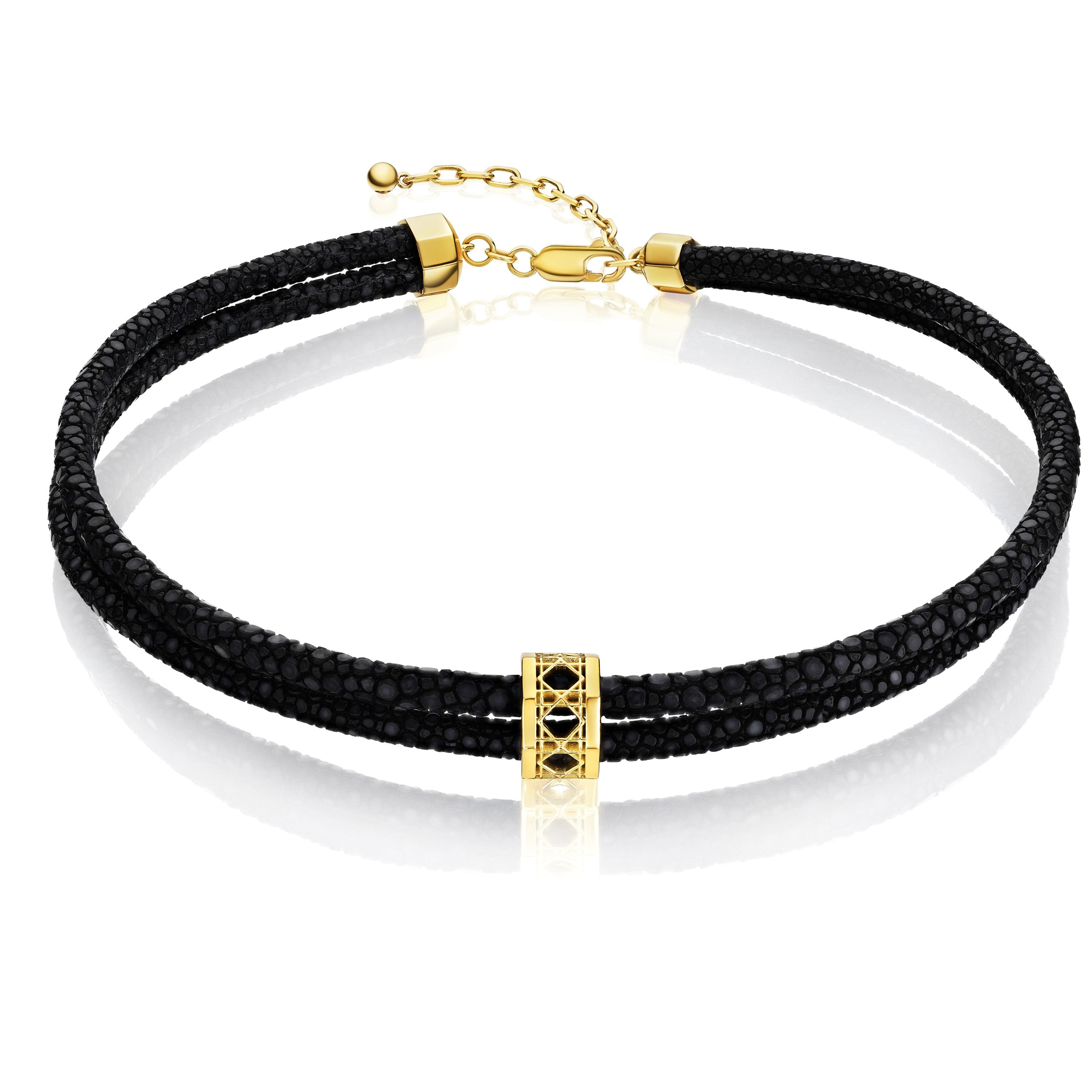 MoAnA LUU Abyss choker in stingray leather and 18K yellow gold, featuring a cane-woven work bead inspired by traditional Caribbean fish traps, reflecting the house’s vision of Creole-inspired fine jewelry crafted in New York.