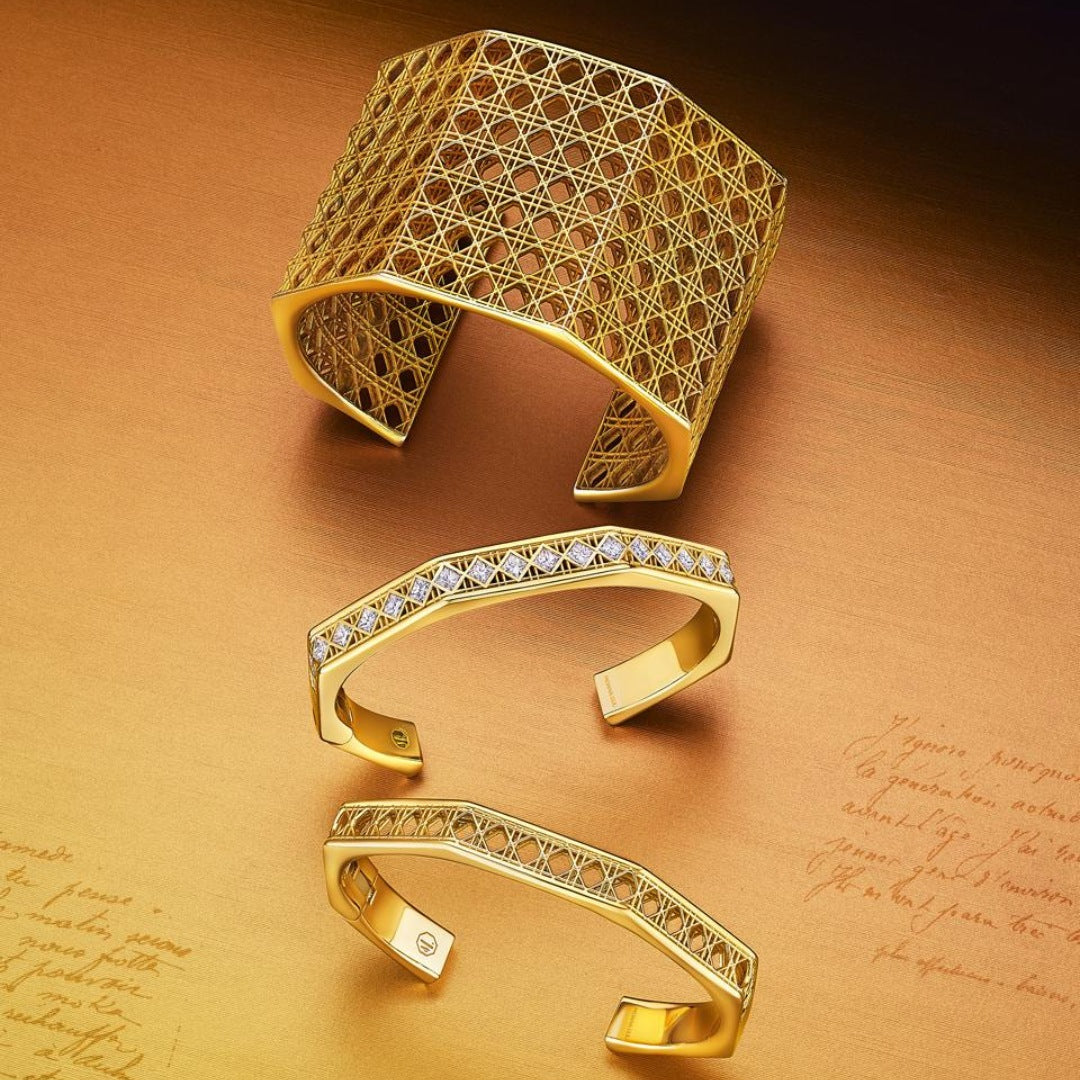 MoAnA LUU Doudou cuff bracelets in 18K yellow gold, featuring sculptural openwork woven design and diamond-set cuff inspired by Caribbean fish traps.