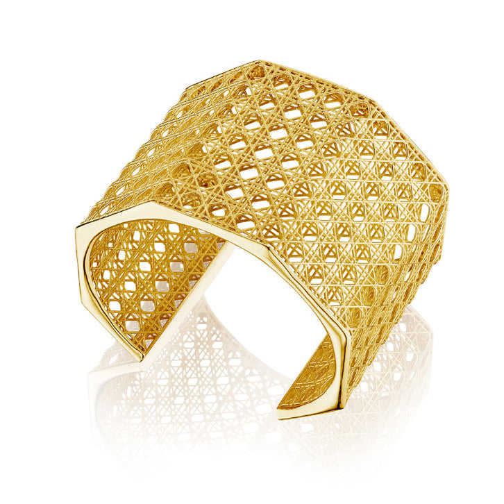 MoAnA LUU Doudou Maxi cuff bracelet  in 18K yellow gold, featuring an intricate woven openwork design inspired by Caribbean fish traps.