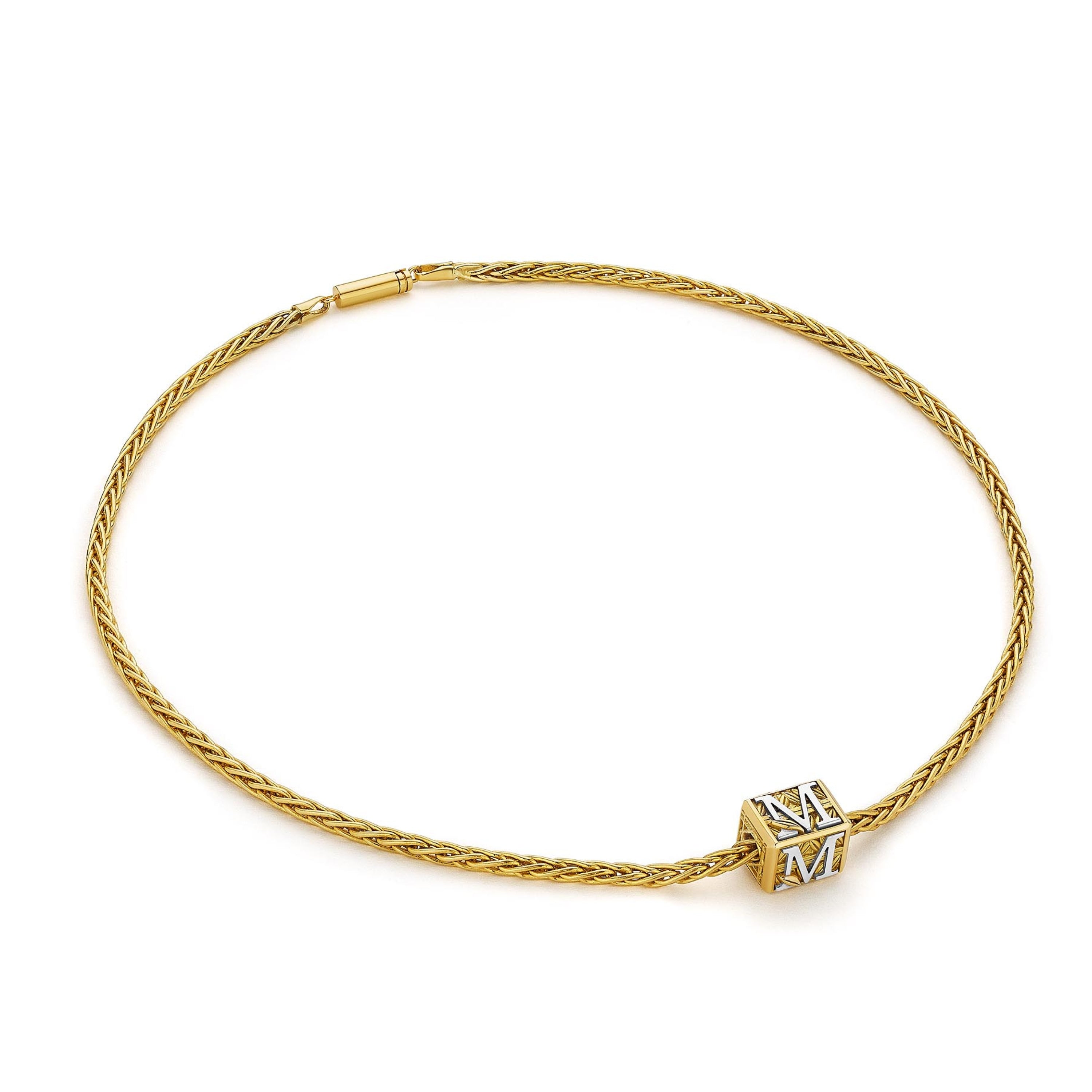 MoAnA LUU Foyal bead necklace in 18K yellow gold, featuring a wheat chain and  “M” letter charm inspired by Creole architectural design.