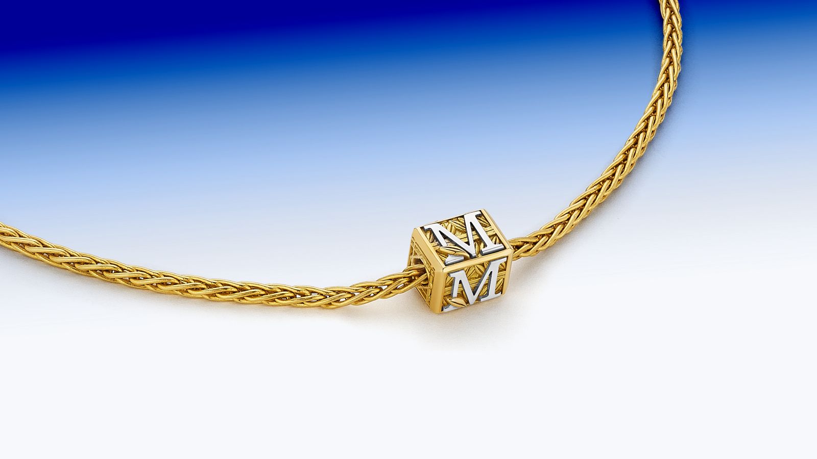 MoAnA LUU Foyal bead initials necklace in 18K yellow gold inspired by Creole architecture. 