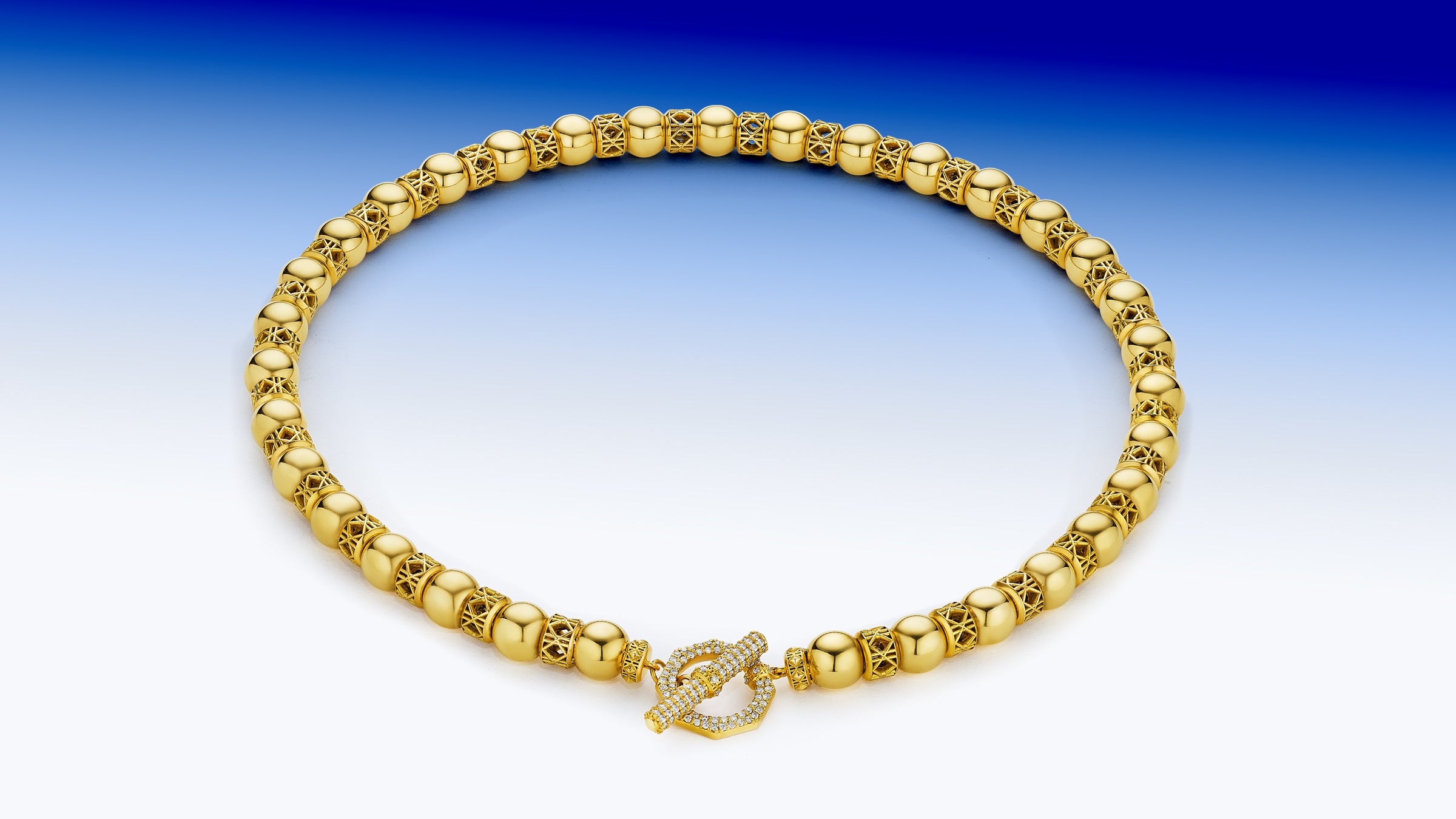 MoAnA LUU Yva bead necklace in 18K yellow gold with diamond encrusted toggle bar lock inspired by Creole jewelry. 